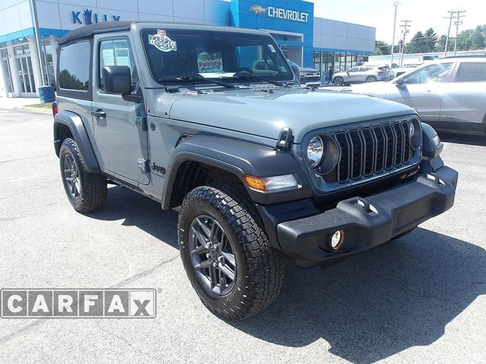 2025 Jeep Wrangler Sport S in Anvil Clearcoat — front three-quarter view