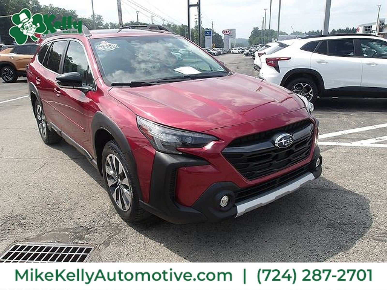 2024 Subaru Outback Limited in Crimson Red Pearl — front three-quarter view