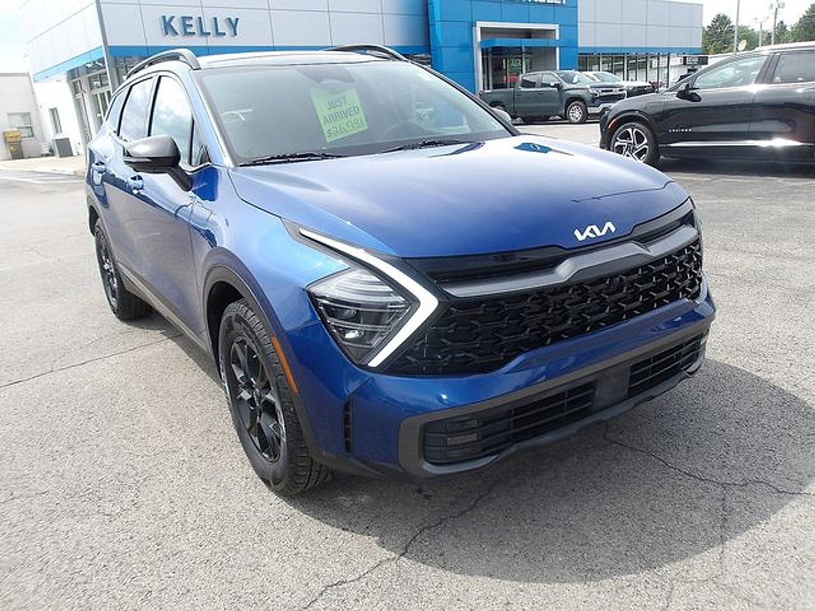 2023 Kia Sportage X-Pro Prestige in Sapphire Blue — front three-quarter view