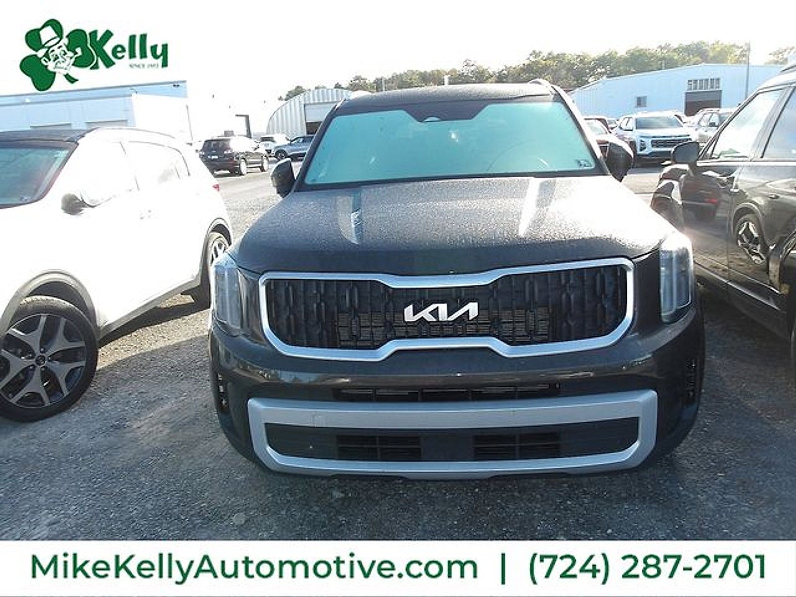 2023 Kia Telluride EX in Dark Moss — front three-quarter view