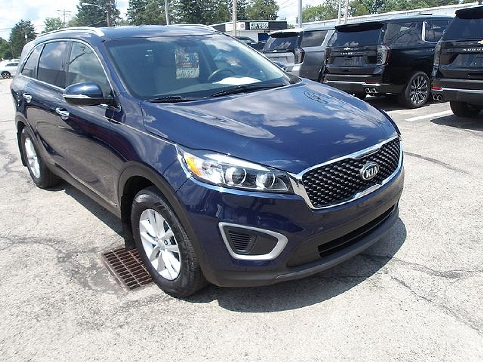 2018 Kia Sorento LX in Blaze Blue — front three-quarter view