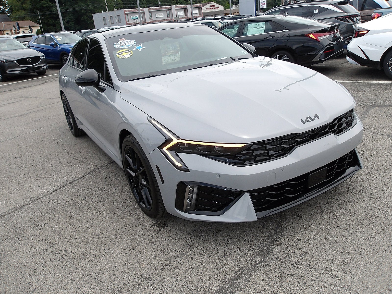 2026 Kia K5 GT in Wolf Gray — front three-quarter view