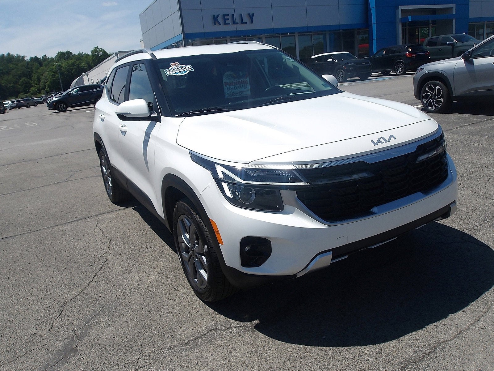 2024 Kia Seltos S in Snow White Pearl — front three-quarter view